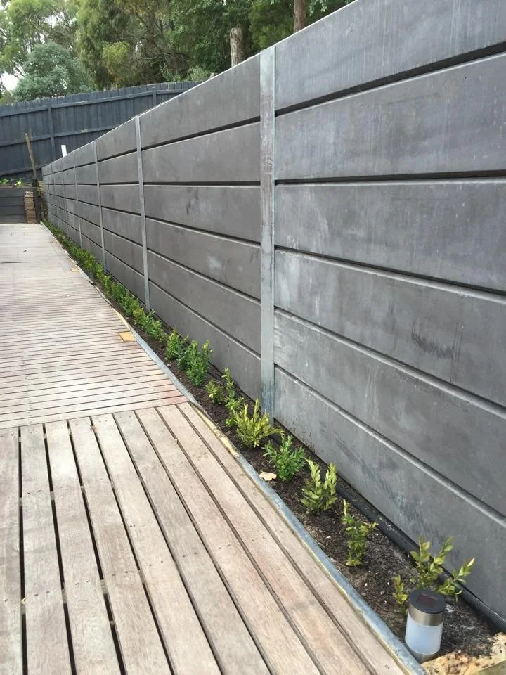 Concrete sleeper retaining wall beside a timber deck
